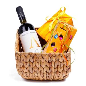 Καλάθι με 1 κρασί ΜΑΛΑΓΟΥΖΙΑ “ΟΙΚΟΓΕΝΕΙΑΣ ΓΚΙΡΛΕΜΗ” και 2 κουτιά με σοκολατένια αυγουλάκια Leonidas
